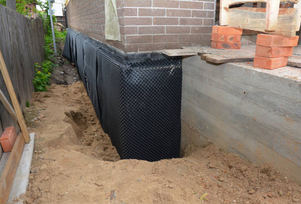 Happy homeowners after waterproofing job in Kingman